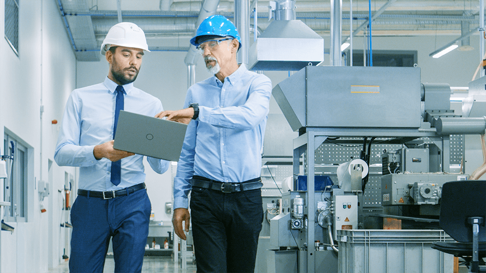 Two men walking the shop floor